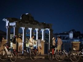 Bikers in front of the Roman remains of Foro Imperiale in Rome