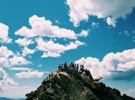 People climbing a rock