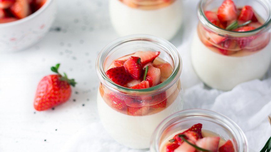 yogurt and strawberries in glass containers