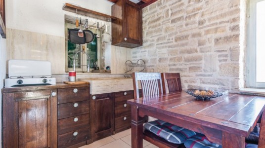 The wooden kitchen and the stone sink
