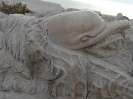 Dolphin carved on the cliff