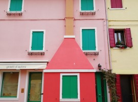 Pink, red and yellow houses with coloured windows