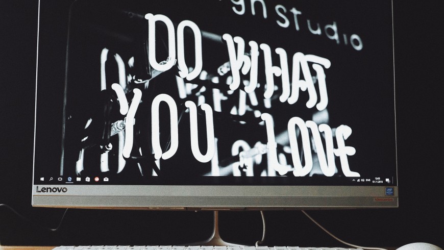 pc screen says "do what you love". Come up with the name of your travel blog