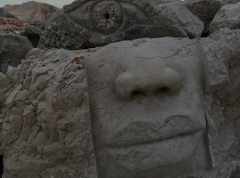 Woman's head carved on the cliff