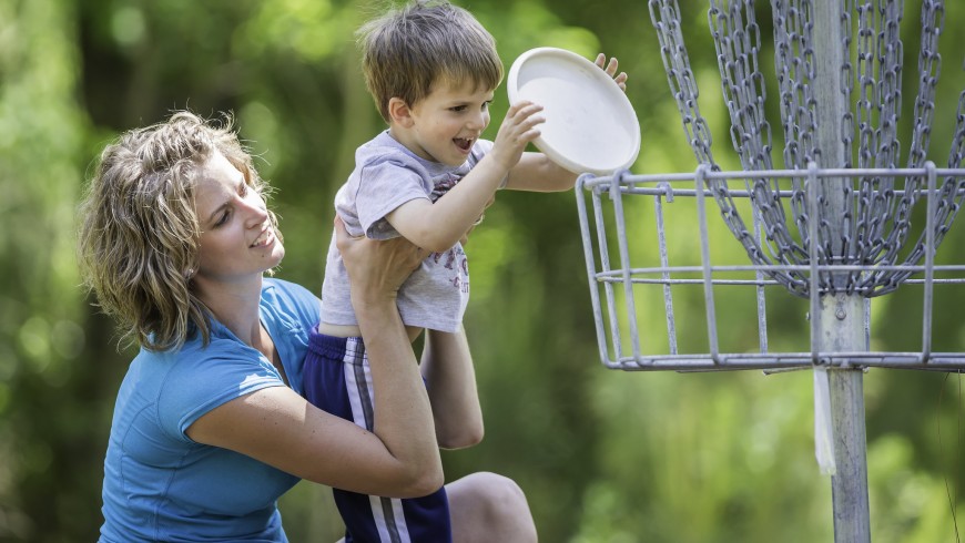 Cherie Knox helps her son Colton Knox as they play disc golf game at the new Bob Rodgers Memorial Disc Golf Course at Sam Houston Jones State Park near Lake Charles, La.