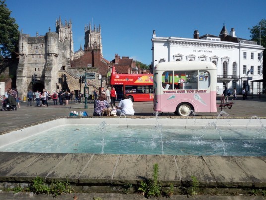 city centre of York with a touristic bus running through the city