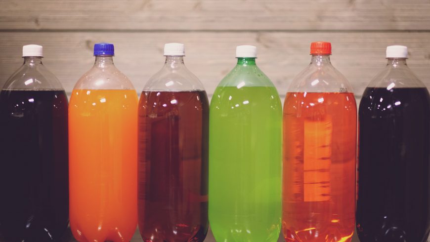 Plastic bottles containing sugar beverages