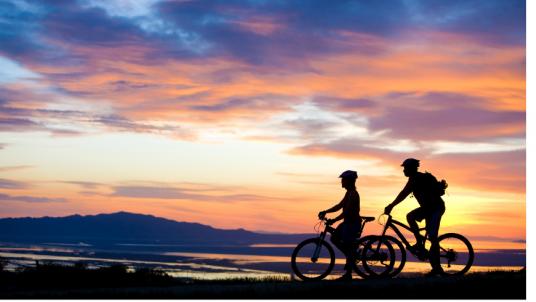 Biking couple at sunset