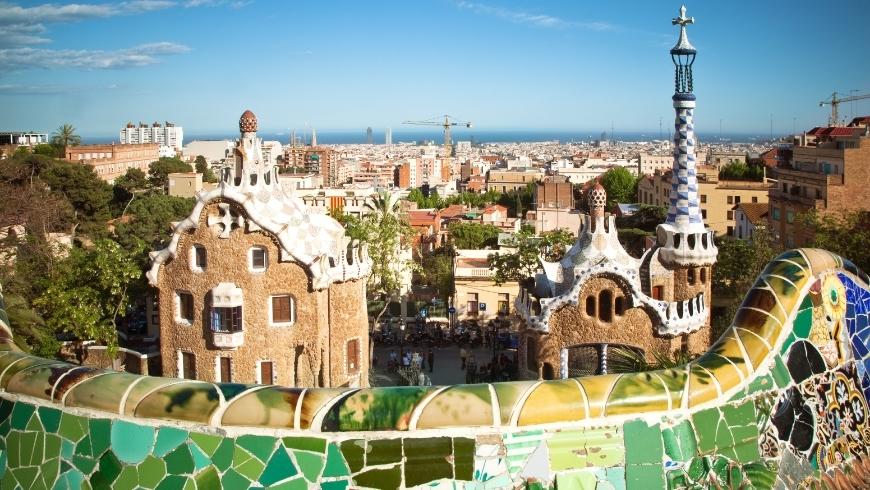 Park Güell in Barcelona, where Gaudì's works blend with the surrounding nature, an eco-friendly tourist attraction that you cannot miss during your next trip in Spain by train