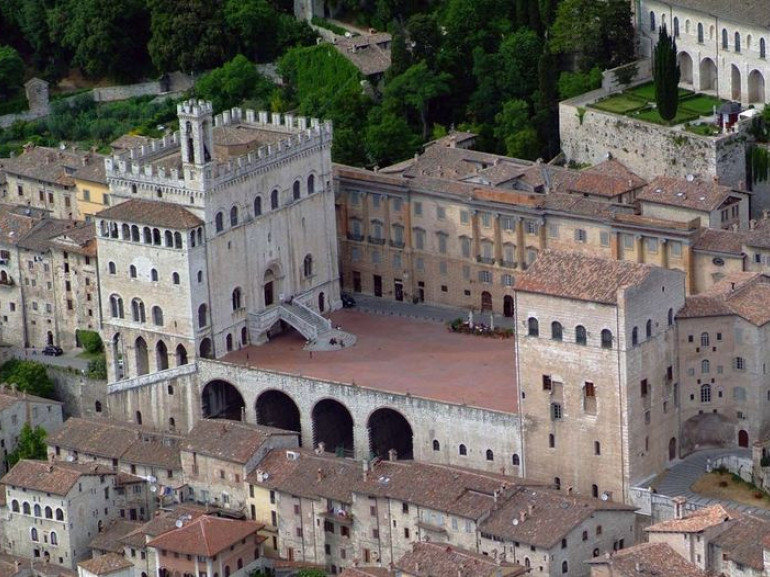 the central square of the city of gubbio and the ancient buildings surrounding it