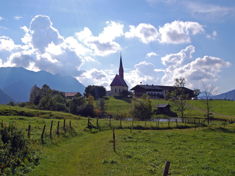 a small village surrounded by the countryside. You can see the church and some houses