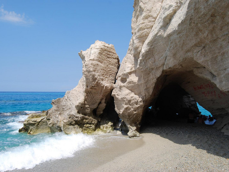 the white marine cave of Tropea on a the blue sea