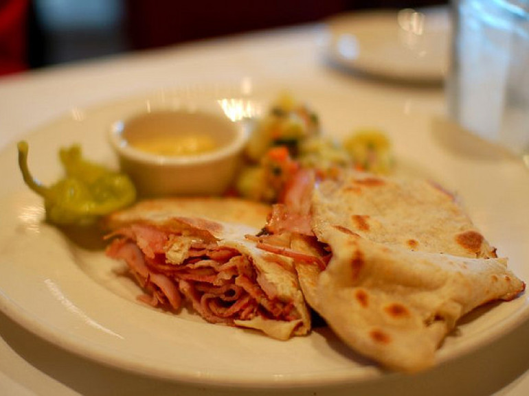 The piadina is a compound of flour, water and lard spread and baked on a griddle. It is usually topped with soft cheeses such as sqacquerone and cheese and cold meats or with a variety of sweet.