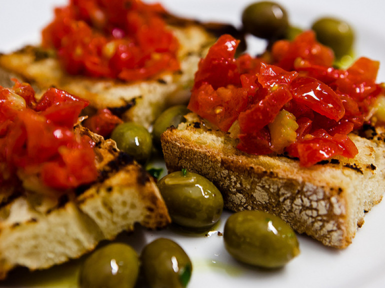 slices of bread with tomatoes and olive
