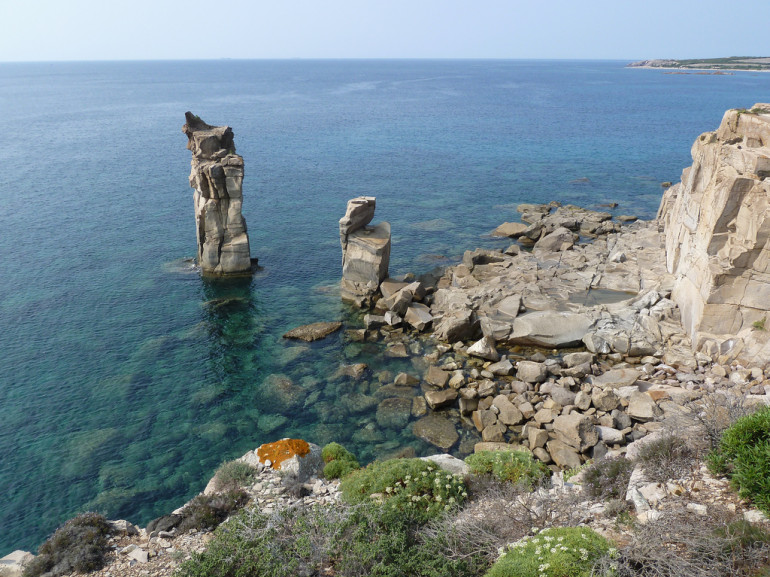 two rocky pillars emerging from the sea