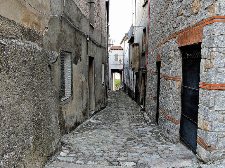 a street through stone houses