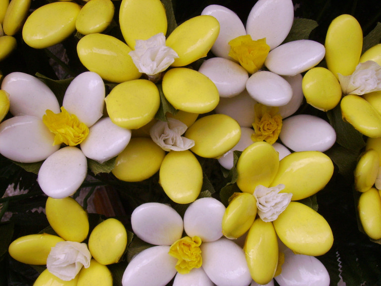 white and yellow candies, making flowers