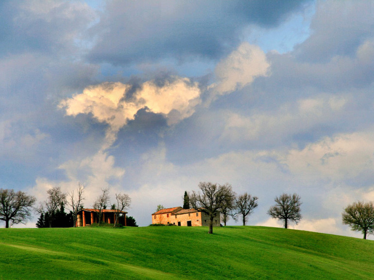 green hills, a country house and a beautiful sky after the storm