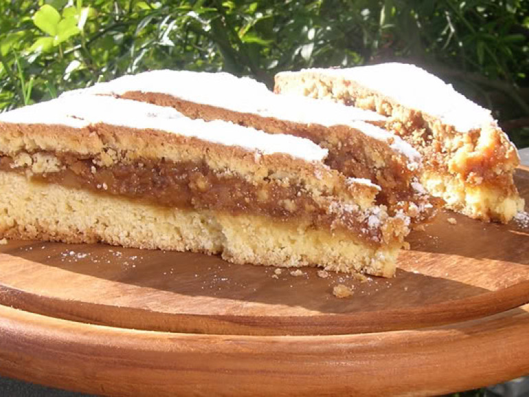a slice of cake with nuts